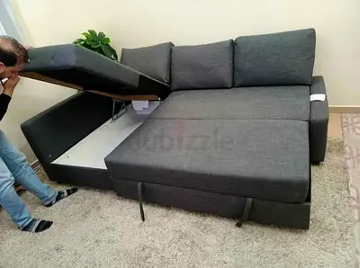 Gray L-shaped sofa bed with storage (good condition)