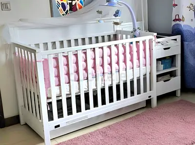 Elegant White Crib with Soft Bedding