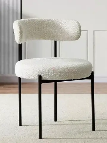 modern white bouclé accent chair with black metal frame
