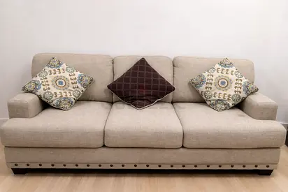 Comfortable Beige Sofa with Decorative Cushions
