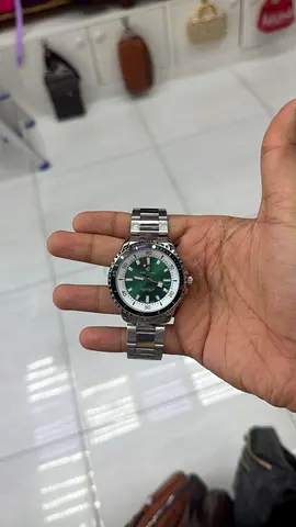 Mens stainless steel sport watch with green dial - used