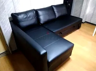 Modern Black Leather Sofa with Sleeper Functionality