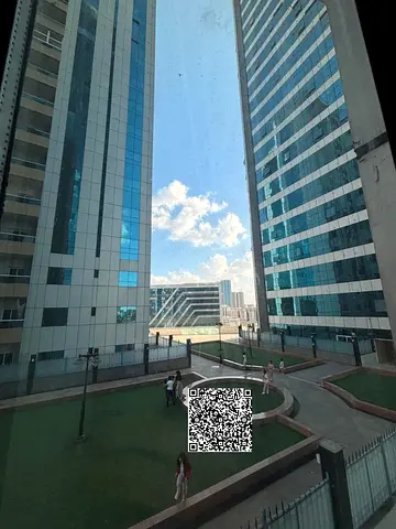 For sale in Ajman: 2 bedrooms and a living room in Orient Towers, with parking, gym, and swimming pool. Only 200,000 AED down payment.