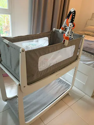 My wooden baby crib — light oak finish, good condition