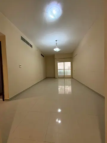 One-bedroom apartment for annual rent in Al Jurf 3, Ajman. Master bedroom with balcony and two bathrooms. Central air conditioning and free parking. P