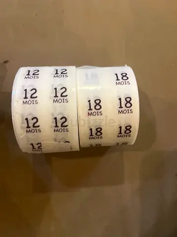 Unused rolls of baby clothing size stickers — 12 mois  18 mois