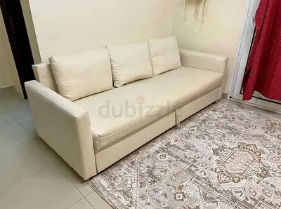 Cream 3-seater sofa with cushions — good condition