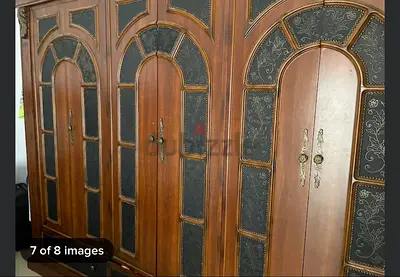 Elegant Wooden Armoire with Intricate Design