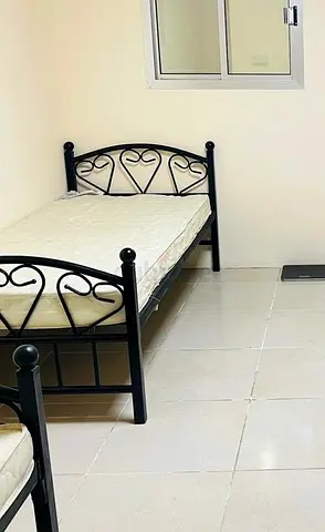 Single black metal bed frame with mattress (used)