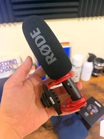 Rode on-camera shotgun microphone with red shock mount