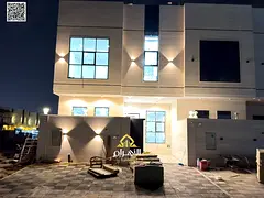 Luxury villa for sale in Al Bahia area, featuring two floors and a rooftop terrace. Modern design, s