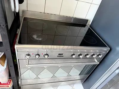 Stainless steel electric range with ceramic hob and oven - used