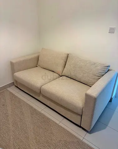 Comfortable Two-Seater Sofa bed beige colours