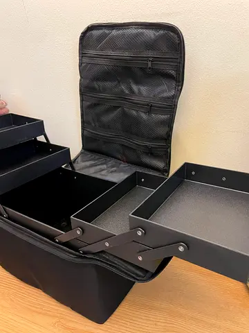 Black fold-out professional makeup/train case with shoulder strap