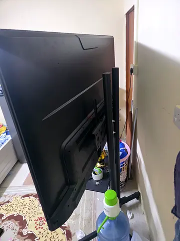 Flat Panel Television end less screen smart TV for Sale smart remote with pointer with moving stand