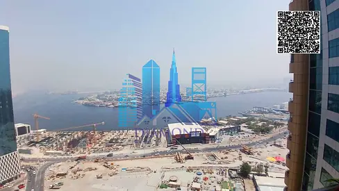 For sale with furniture, an empty apartment with two rooms and a hall, an open view of the creek, owned by Harb, Horizon Towers, Ajman Emirate.