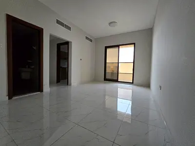 1BR + living in Al Rawda 1, new building, 2 baths + master, balcony, wardrobes, main road, AED 32k/6 payments.