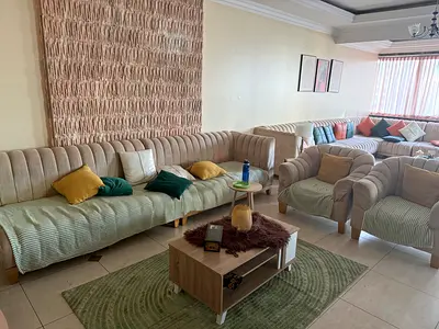Cozy couch and arm chairs in Neutral Tones
