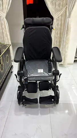 Adjustable pediatric wheelchair - head and leg support