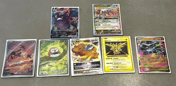 Lot of 8 Pokémon cards — holo/EX/gold rares (the secret bundle)