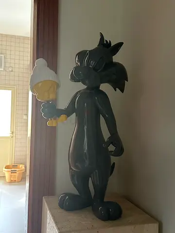 My glossy ceramic Disney cartoon cat statue (Sylvester holding twitter )