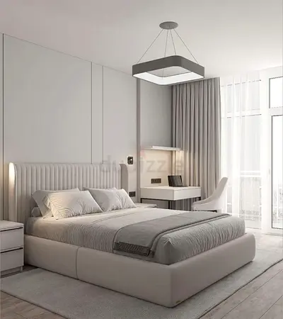 Light grey upholstered platform bed with padded headboard