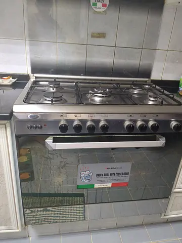 Stovetop - My stainless-steel 5-burner gas range with built-in oven