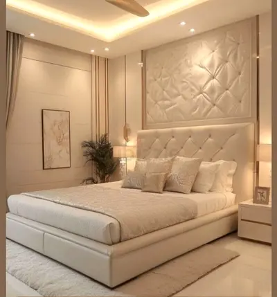 Cream upholstered king-size bed with padded headboard