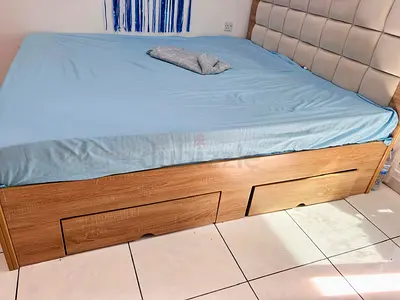 Bed with side table and dressing table