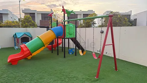 Colorful Outdoor Playset with Slide and Swings