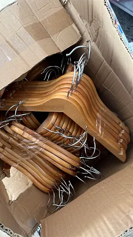 Single solid wooden coat hanger with metal hook