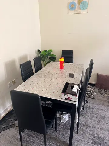 Elegant Dining Table Set with Black Chairs