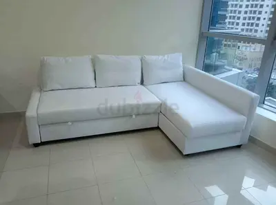 White L-shaped corner sofa bed with chaise (used)