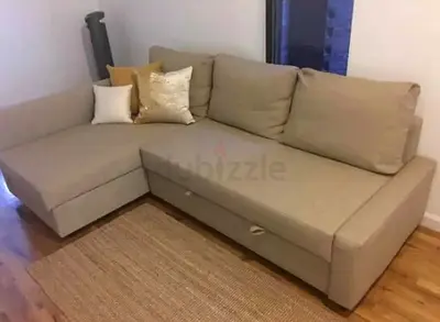 Beige L-shaped sectional sofa bed with storage chaise (used, good condition)