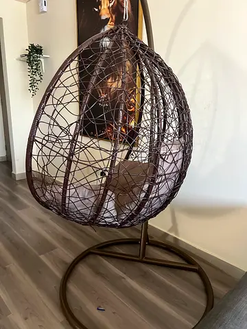 My brown rattan hanging egg chair with metal stand