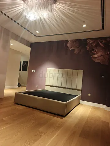 Beige Upholstered Platform Bed with Padded Headboard