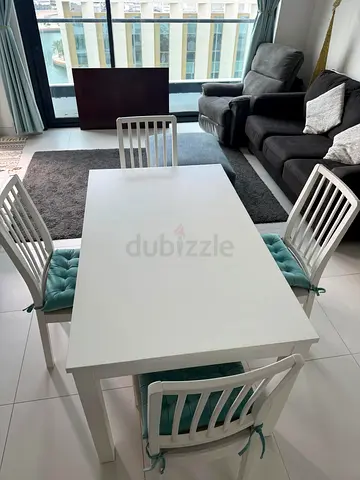 White 4-Seater Dining Table with Cushioned Chairs
