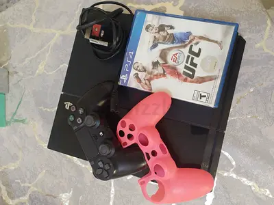 Playstation 4 with controller and game