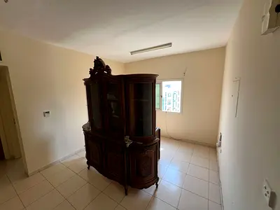 Family one bedroom and living room apartment with a comfortable space and central AC in Al Butina Sharjah close to all services and shopping centers