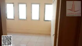 Two bedrooms and a living room for annual rent in Sharjah, in Al Hammadi 1 building in Abu Shagara. 