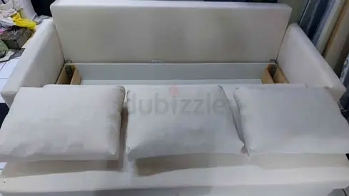 Beige 3-seater fabric sofa bed with under-seat storage