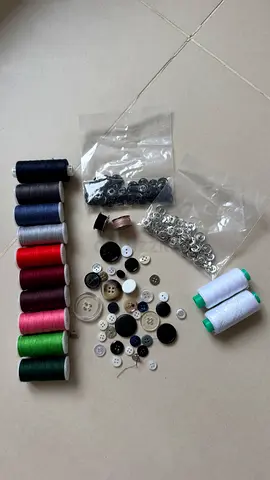 Assorted sewing kit — threads, buttons  snaps