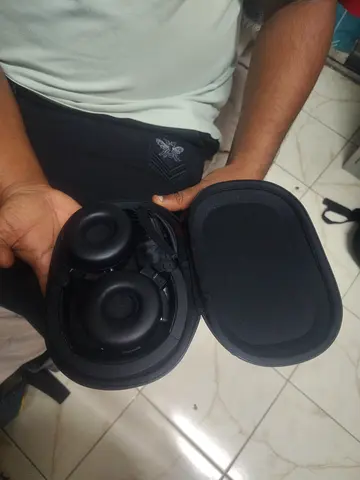 My unused over-ear headphones — includes hard travel case