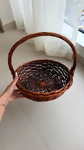 Woven wicker basket with handle