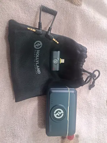 Hollyland wireless audio unit with cables and pouch