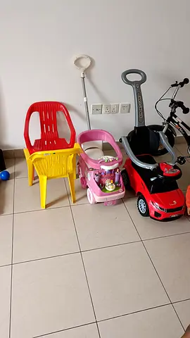My kids ride-on push cars and plastic chairs