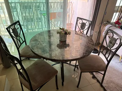 Elegant Round Dining Table with Four Chairs
