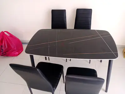 Brand New dining table with 4 chairs available