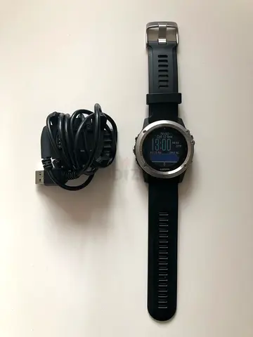 Garmin smartwatch with charging cable