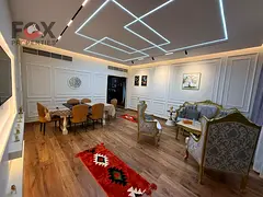 Luxury two-bedroom apartment with a living room, fully furnished, for annual rent in Al Rashidiya 1,
